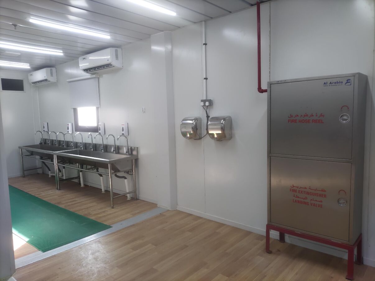 Ablution and washbasin room with a stainless-steel washbasin trough