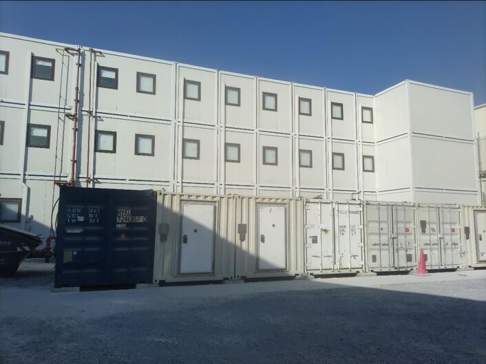 Container storage area beside the modular buildings