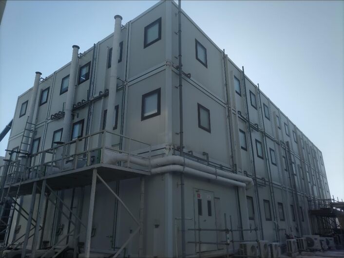 External cladding being fitted to a multi-storey modular building