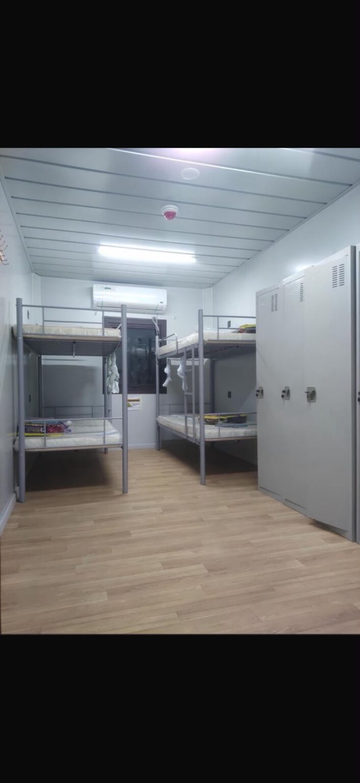 Junior accommodation room fitted with bunk beds and storage lockers