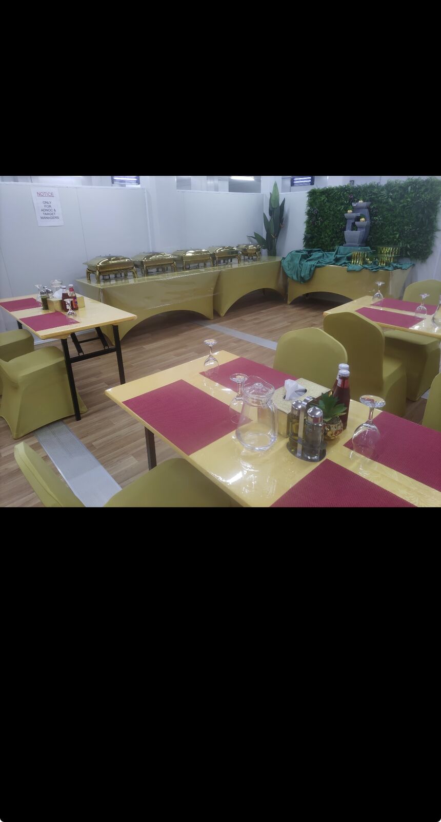 VIP mess hall with set dining tables and upholstered chairs