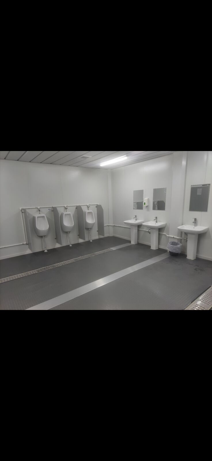 Toilet cubicles and urinals inside the office building