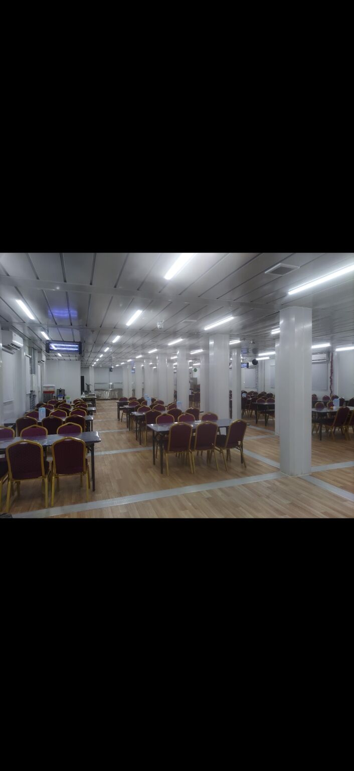 Junior mess hall dining area with tables and chairs