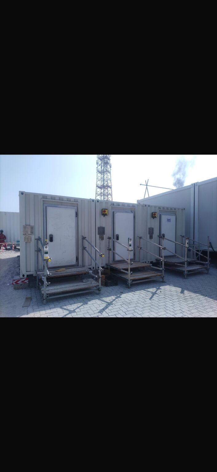 Transit and support containers positioned on site
