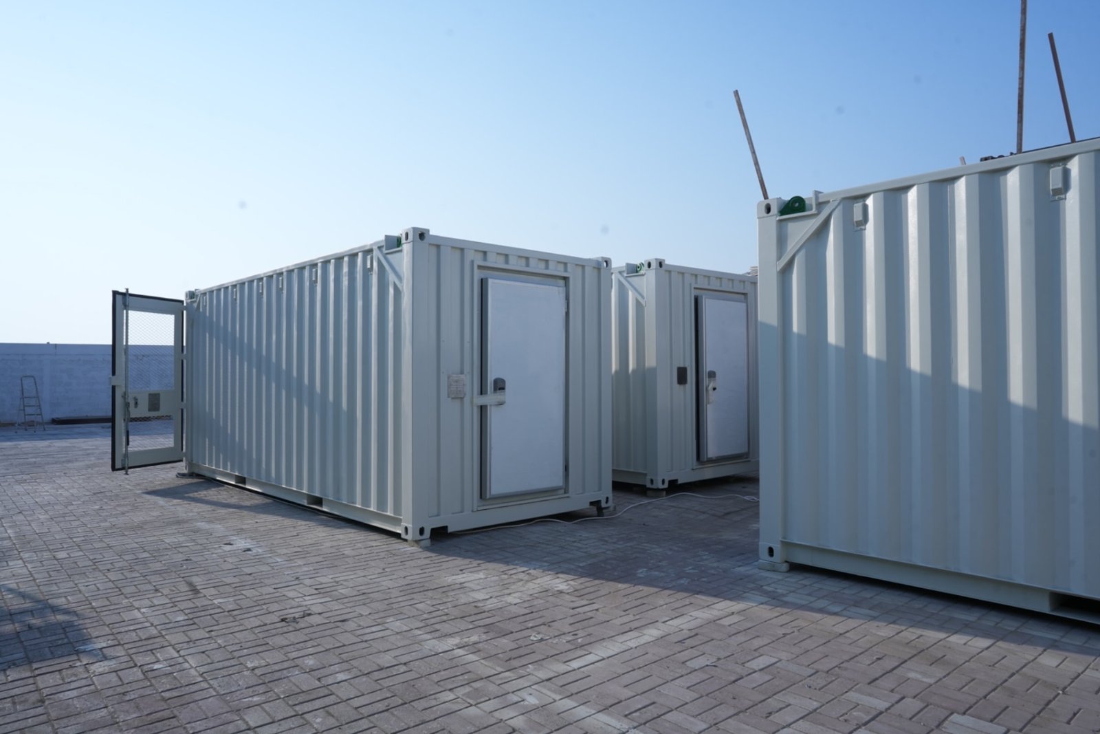 Row of ZAT Cabin cold room container units with insulated doors at the yard